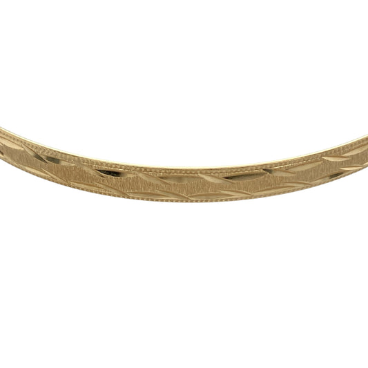 Bring timeless elegance and subtle texture to your jewellery collection with this pre-owned 9ct yellow solid gold patterned bangle, a classic piece designed to complement both everyday and occasion wear.

Design: This bangle showcases a traditional circular profile with a decorative patterned finish, adding depth and visual interest while maintaining a refined and versatile look.