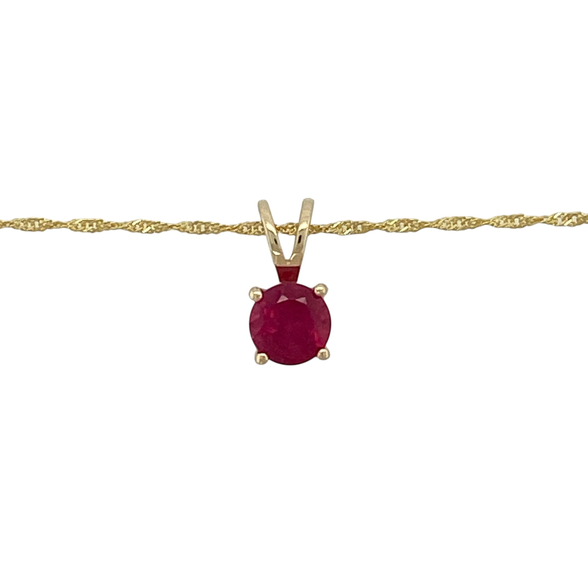 Bring rich colour and delicate elegance to your jewellery collection with this pre-owned 9ct yellow gold and ruby pendant necklace, a refined piece ideal for everyday wear or subtle occasion styling.

Design: The necklace features a vibrant round ruby displayed in a classic pendant design, suspended from a fine Singapore chain that adds gentle movement and sparkle.
Material: Made from 9-carat yellow gold, the warm golden tone beautifully complements the deep red hue of the ruby.