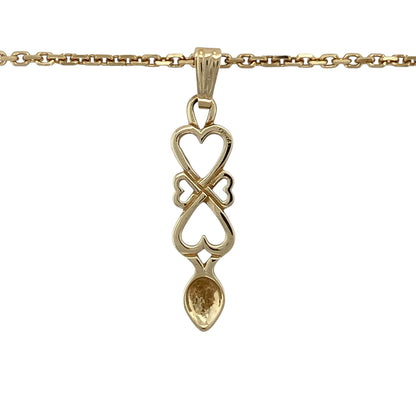 Bring romantic symbolism and traditional Welsh charm to your jewellery collection with this pre-owned 9ct yellow gold Welsh lovespoon pendant necklace, a meaningful piece rich in heritage.

Design: The necklace features a detailed Welsh lovespoon pendant, a traditional symbol of love and commitment, suspended from a classic belcher chain for a timeless finish.
Material: Made from 9-carat yellow gold, the warm polished tone highlights the intricate detail of the lovespoon and enhances its enduring appeal.