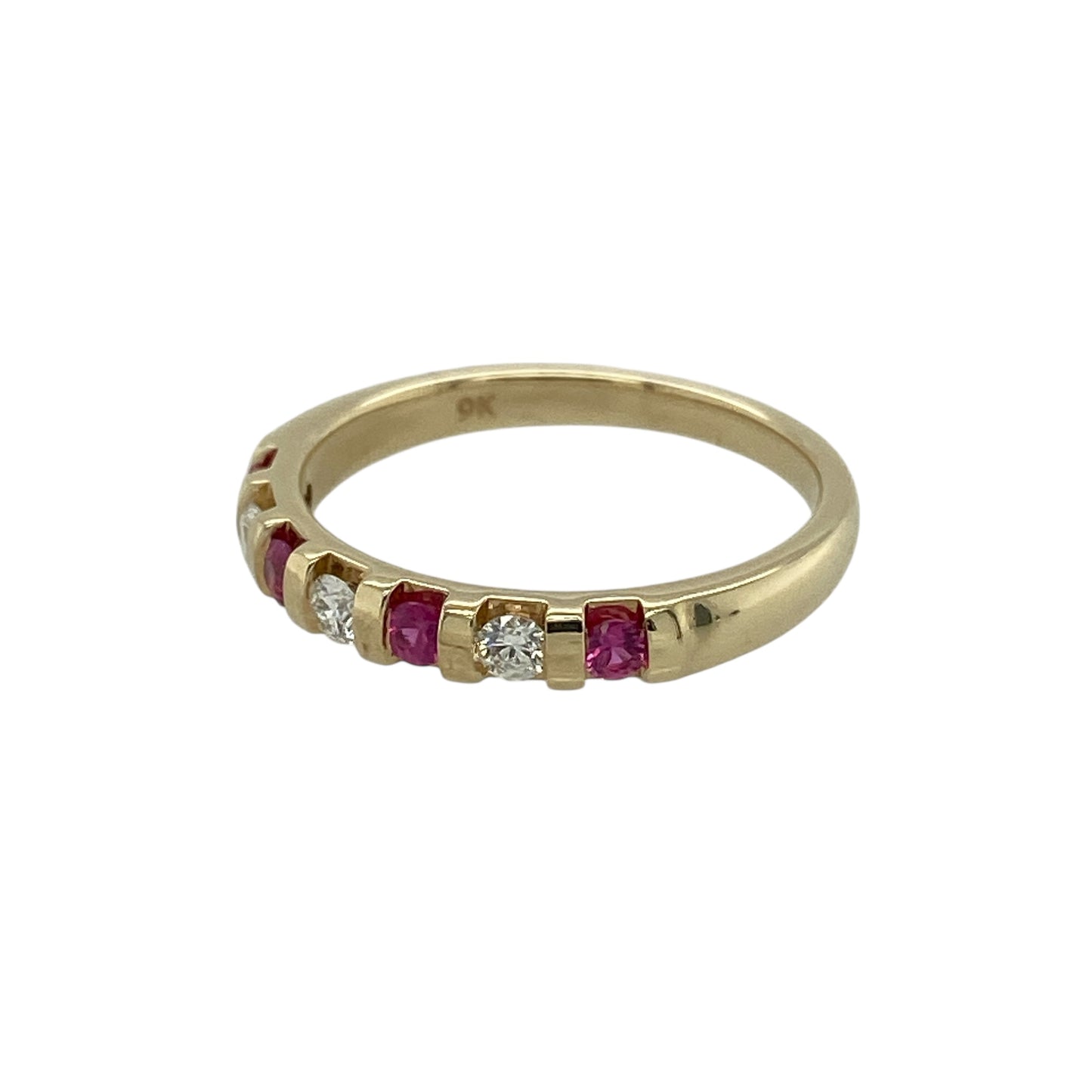 Bring classic colour and subtle sparkle to your jewellery collection with this pre-owned 9ct yellow gold diamond and ruby set band ring, a refined piece perfect for everyday wear or meaningful gifting.

Design: The ring features a slim band adorned with vibrant round rubies, each accented with diamond detail, creating a timeless and elegant combination of colour and sparkle.