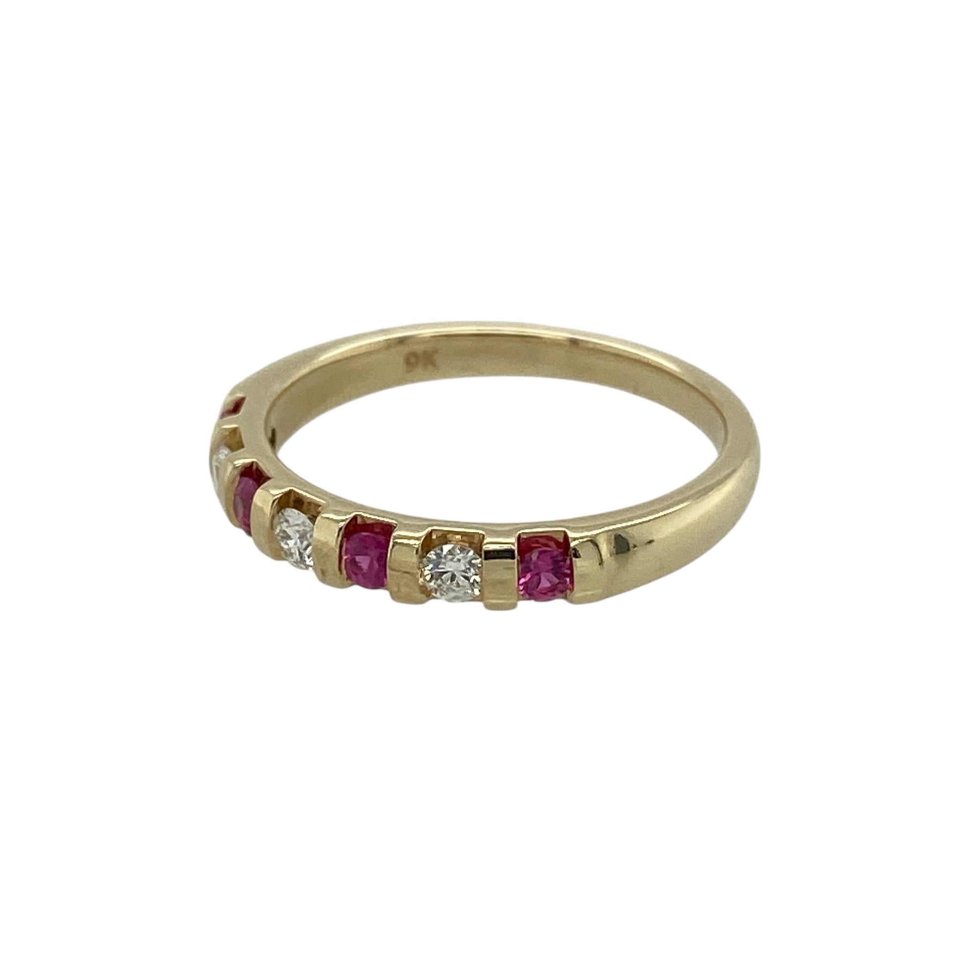 Bring classic colour and subtle sparkle to your jewellery collection with this pre-owned 9ct yellow gold diamond and ruby set band ring, a refined piece perfect for everyday wear or meaningful gifting.

Design: The ring features a slim band adorned with vibrant round rubies, each accented with diamond detail, creating a timeless and elegant combination of colour and sparkle.