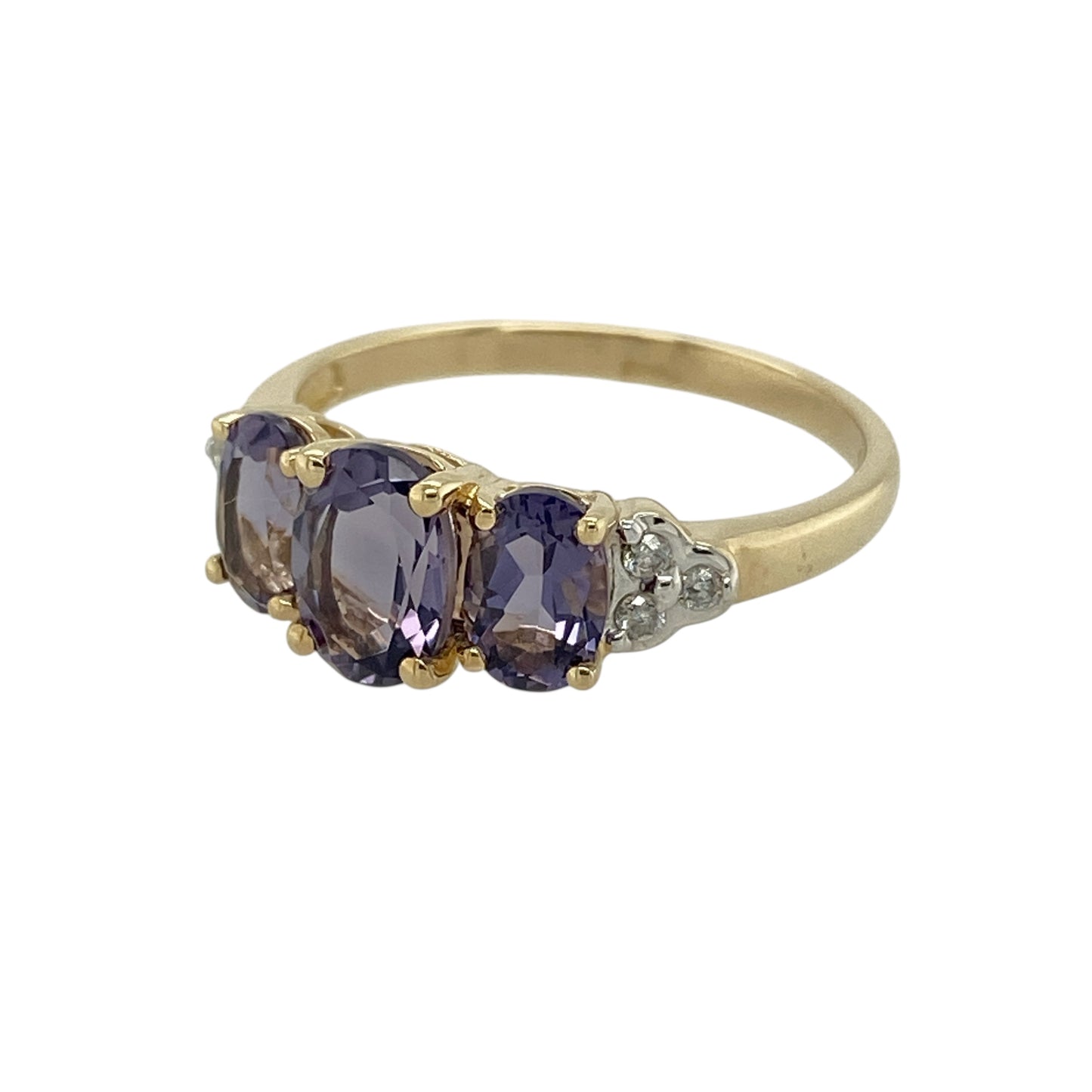 Bring elegant colour and refined sparkle to your jewellery collection with this pre-owned 9ct yellow gold diamond and tanzanite set trilogy ring, a beautifully balanced design with timeless appeal.

Design: The ring showcases a striking oval tanzanite at the centre, flanked by two smaller oval tanzanite stones, with diamond accents on either side to enhance the overall brilliance and symmetry of the trilogy layout.