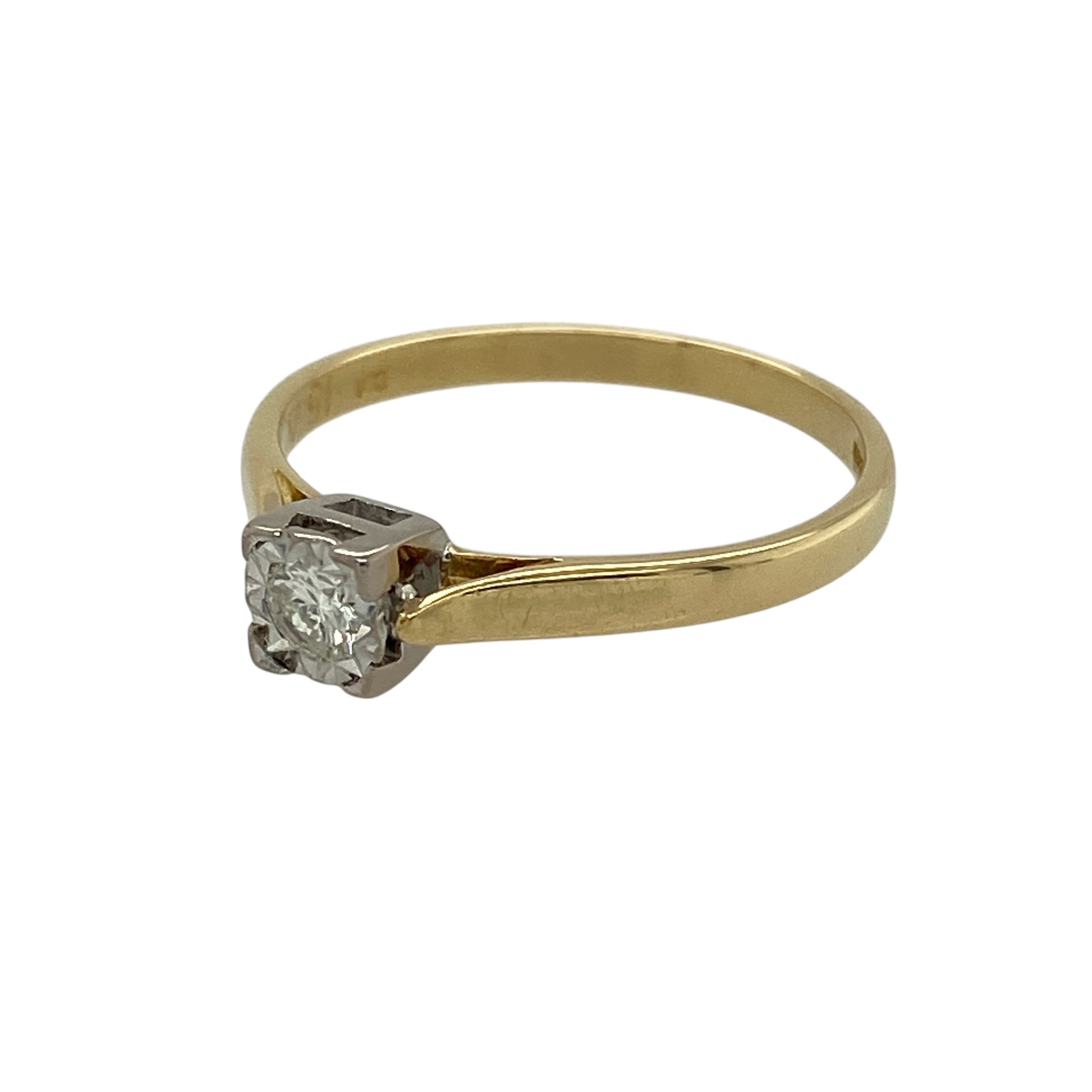 Bring classic charm and understated elegance to your jewellery collection with this pre-owned 18ct yellow gold diamond set vintage solitaire ring, a timeless design with enduring appeal.

Design: This ring features a single brilliant-cut diamond presented in a square setting, giving a subtle vintage character while maintaining a clean and elegant silhouette.
Material: Made from rich 18-carat yellow gold, the warm polished finish beautifully enhances the diamond’s sparkle and the ring’s classic style.