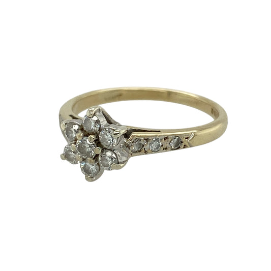 Bring delicate sparkle and timeless charm to your jewellery collection with this pre-owned 9ct yellow gold diamond set flower cluster ring, a beautifully feminine design with classic appeal.

Design: This ring features a floral-style diamond cluster at the centre, creating a soft, elegant focal point, with diamond-set shoulders that add extra brilliance and refined detail.