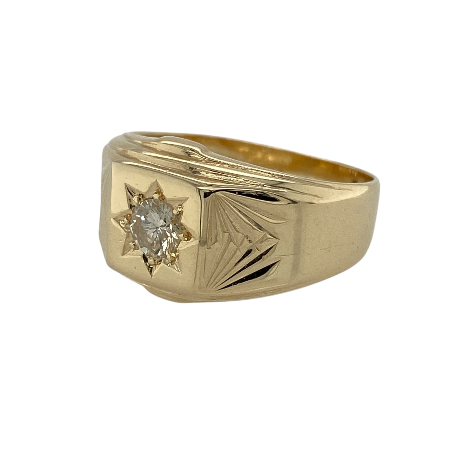 Bring bold elegance and timeless sparkle to your jewellery collection with this pre-owned 9ct yellow gold diamond set signet ring, a striking piece with classic appeal.

Design: This ring features a traditional signet-style head highlighted by a starburst set brilliant-cut diamond, creating a strong focal point with refined brilliance.
Material: Made from 9-carat yellow gold, the warm polished finish enhances the bold silhouette and complements the diamond’s sparkle.