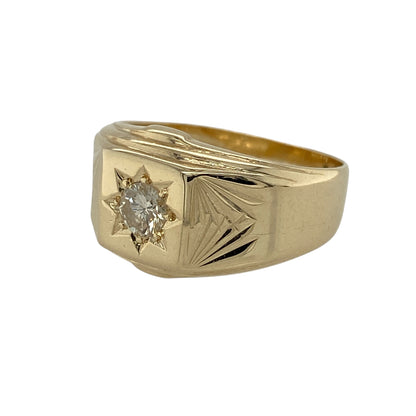 Bring bold elegance and timeless sparkle to your jewellery collection with this pre-owned 9ct yellow gold diamond set signet ring, a striking piece with classic appeal.

Design: This ring features a traditional signet-style head highlighted by a starburst set brilliant-cut diamond, creating a strong focal point with refined brilliance.
Material: Made from 9-carat yellow gold, the warm polished finish enhances the bold silhouette and complements the diamond’s sparkle.