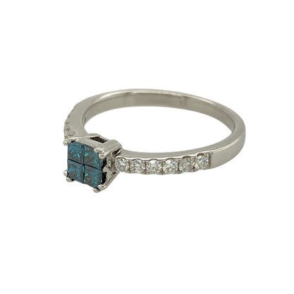 Bring striking colour and contemporary elegance to your jewellery collection with this pre-owned 14ct white gold blue enhanced diamond set solitaire ring, a distinctive design with refined sparkle.

Design: This ring features a central solitaire-style head made up of four princess-cut blue enhanced diamonds arranged together to create a bold focal point, complemented by white brilliant-cut diamonds set along the shoulders for added brilliance.