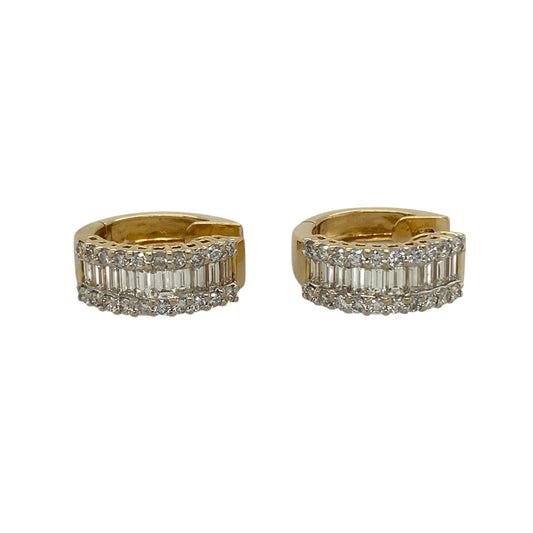 Bring refined brilliance and timeless luxury to your jewellery collection with this pre-owned 18ct yellow gold diamond set huggie earrings, an exceptional pair designed to make a confident and elegant statement.

Design: These huggie-style earrings feature a striking combination of baguette and brilliant-cut diamonds, creating a sophisticated contrast of clean lines and radiant sparkle.