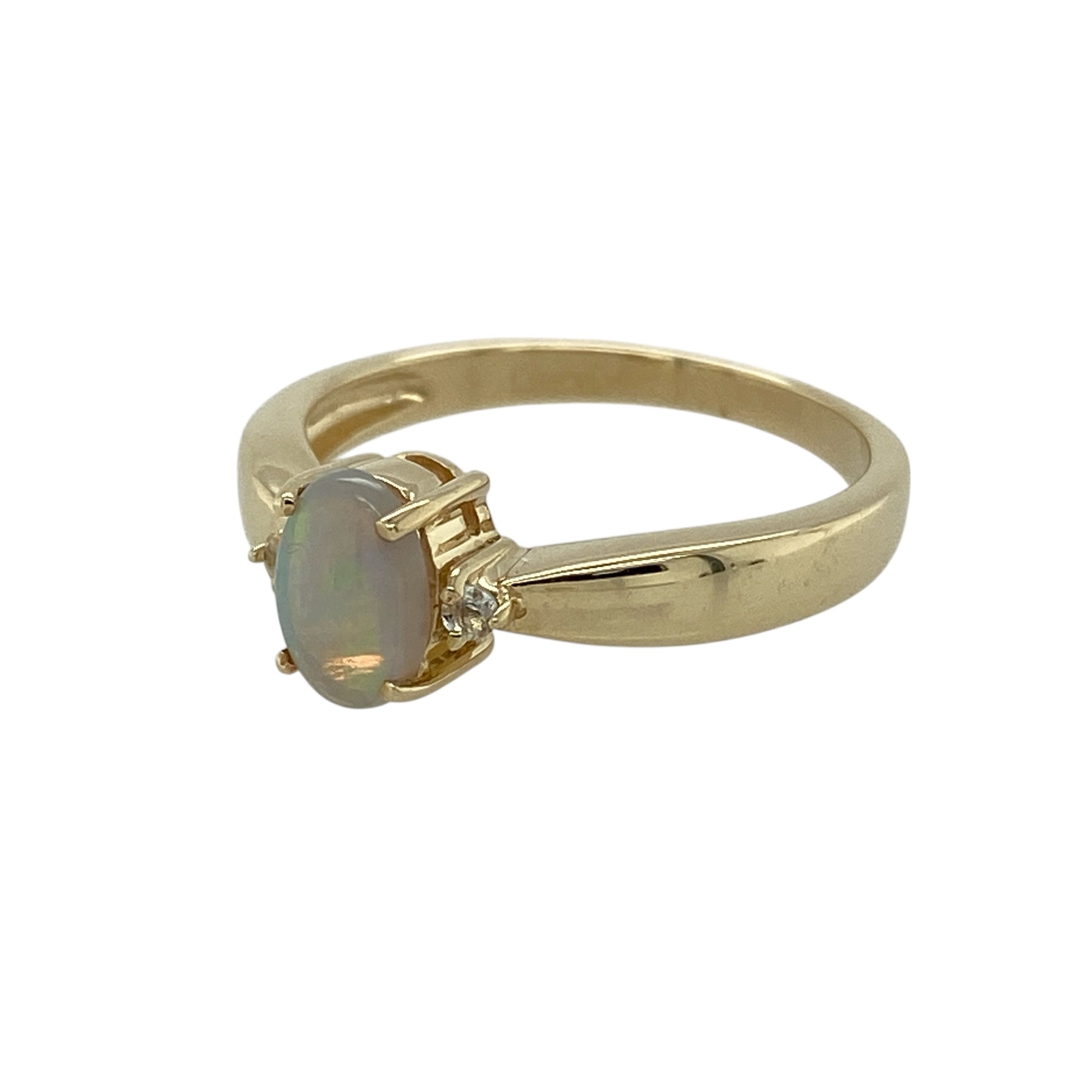 Bring soft iridescence and refined elegance to your jewellery collection with this pre-owned 9ct yellow gold opalique and white topaz solitaire ring, a graceful design with timeless charm.

Design: This ring features a smooth oval opalique stone at the centre, displaying gentle flashes of colour, enhanced by white topaz accents that add subtle sparkle and balance.