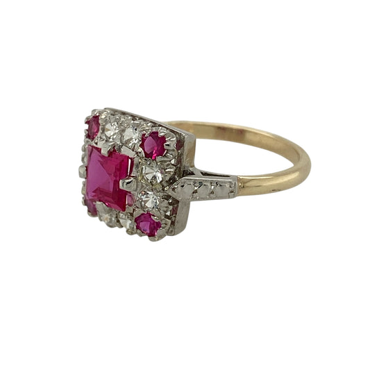 Bring vibrant colour and classic sparkle to your jewellery collection with this pre-owned 9ct yellow and white gold ruby and cubic zirconia set square cluster ring, a striking design with elegant contrast.

Design: This ring features a square ruby-coloured centre stone, framed by surrounding ruby-coloured stones and cubic zirconias arranged in a classic cluster style for added brilliance and depth.