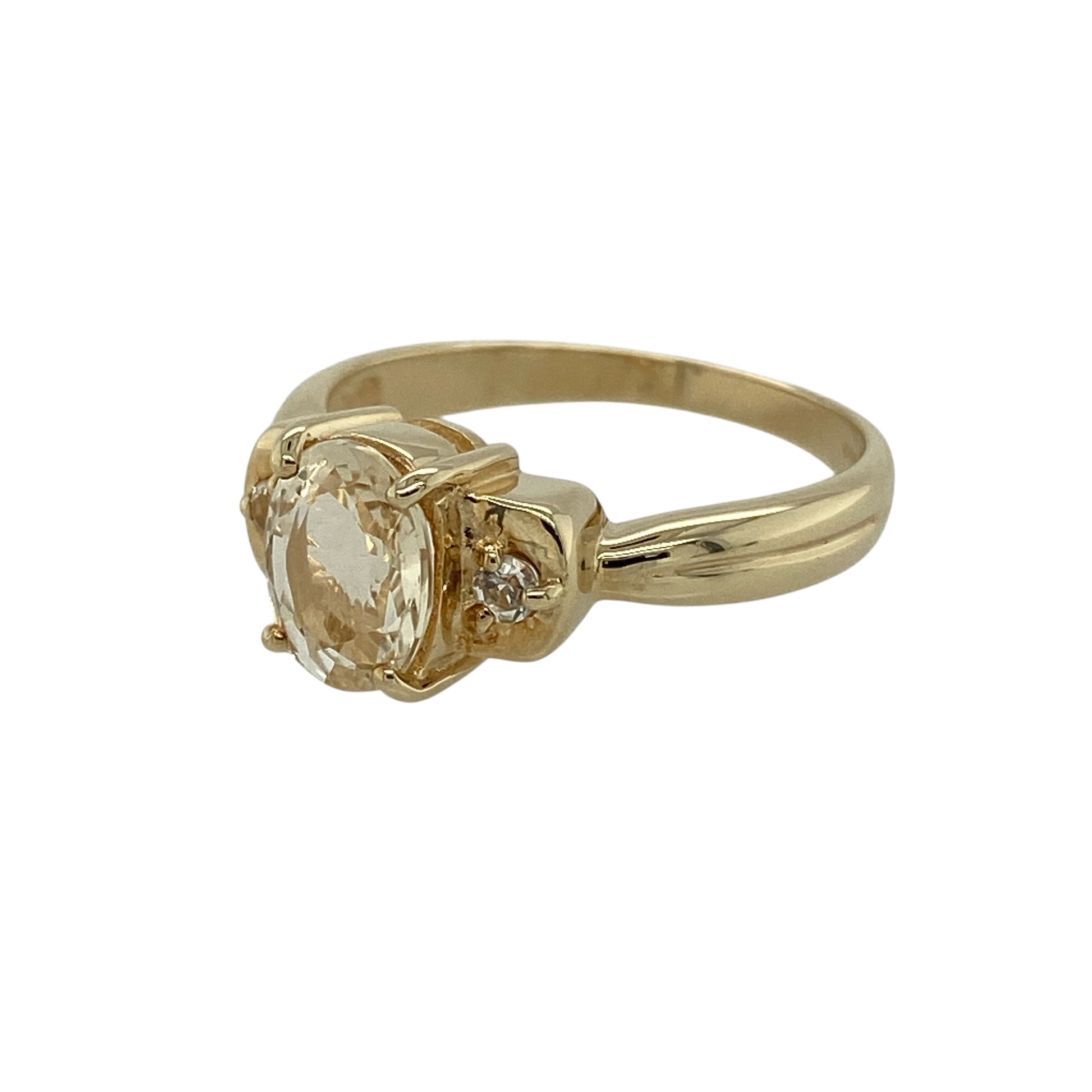 Bring warm, natural tones and refined sparkle to your jewellery collection with this pre-owned 9ct yellow gold scapolite and white topaz set ring, a distinctive piece with elegant appeal.

Design: This ring features an oval scapolite at the centre, complemented by white topaz accents that enhance the stone’s subtle golden hue and add gentle brilliance.
