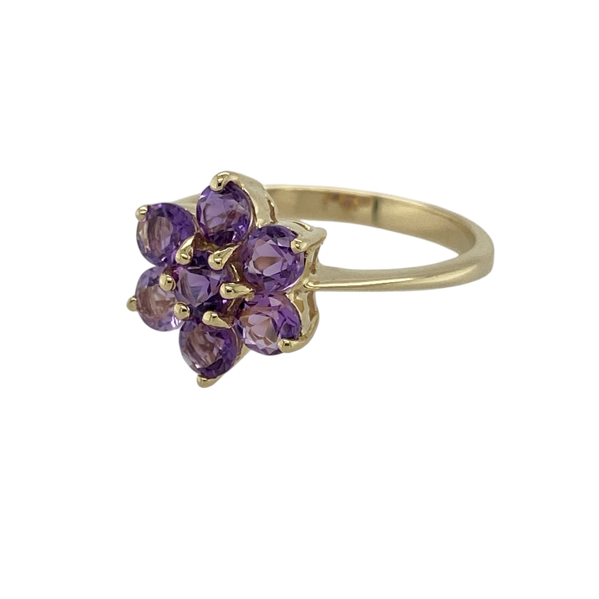 Bring rich colour and classic elegance to your jewellery collection with this pre-owned 9ct yellow gold Uruguayan amethyst set cluster ring, a refined design with timeless charm.

Design: This ring features a vibrant cluster of round Uruguayan amethyst stones arranged across the front, creating a bold yet elegant focal point with beautiful depth of colour.
Material: Made from 9-carat yellow gold, the warm polished finish perfectly complements the deep purple hues of the amethysts.