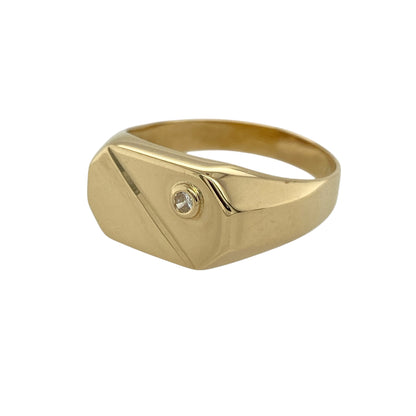 Bring bold style and modern elegance to your jewellery collection with this pre-owned 18ct yellow gold cubic zirconia set geometric signet ring, a striking design with contemporary appeal.

Design: This ring features a geometric-style signet head accented with cubic zirconia stones, creating a clean, architectural look with refined sparkle.
Material: Made from rich 18-carat yellow gold, the warm polished finish enhances the modern lines of the design and adds a luxurious feel.