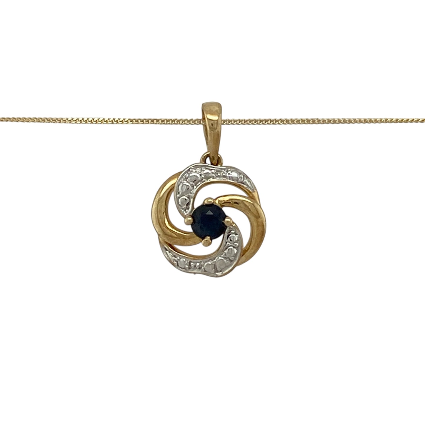 Bring graceful movement and classic colour to your jewellery collection with this pre-owned 9ct yellow and white gold sapphire set swirl pendant necklace, a delicate piece with elegant contrast.

Design: The pendant features a flowing swirl design in yellow and white gold, centred with a rich blue sapphire that adds a refined pop of colour.
Material: Made from a combination of 9-carat yellow and white gold, the contrasting tones enhance the fluid design and timeless appeal.