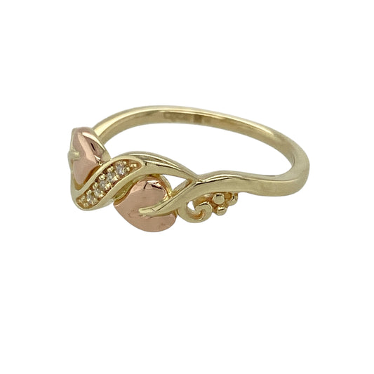 Bring meaningful symbolism and elegant Welsh design to your jewellery collection with this pre-owned 9ct yellow and rose gold diamond set Clogau Tree of Life wrap-over ring, a beautifully expressive piece with timeless appeal.

Design: This ring features the iconic Tree of Life motif in a graceful wrap-over style, symbolising growth, strength, and continuity, accented with a diamond for a touch of refined sparkle.