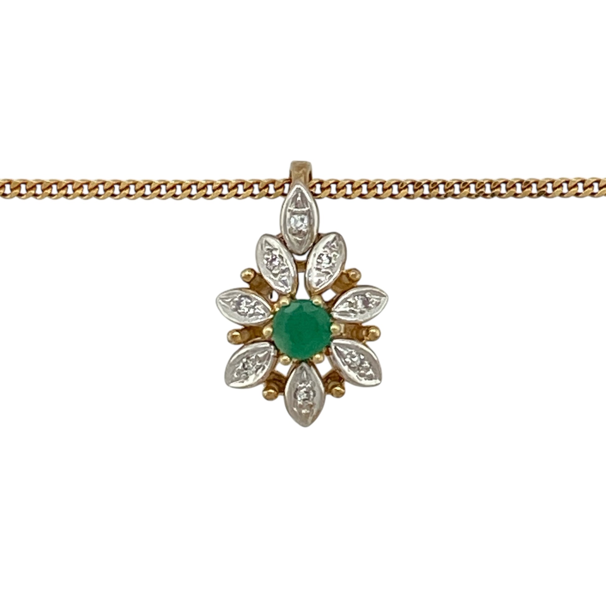 Bring fresh colour and timeless elegance to your jewellery collection with this pre-owned 9ct yellow gold diamond and emerald set flower pendant necklace, a delicate piece with classic charm.

Design: The pendant features a floral-inspired design, centred with a vivid green emerald and accented by diamond detailing, creating a beautifully balanced and feminine look.
Material: Made from 9-carat yellow gold