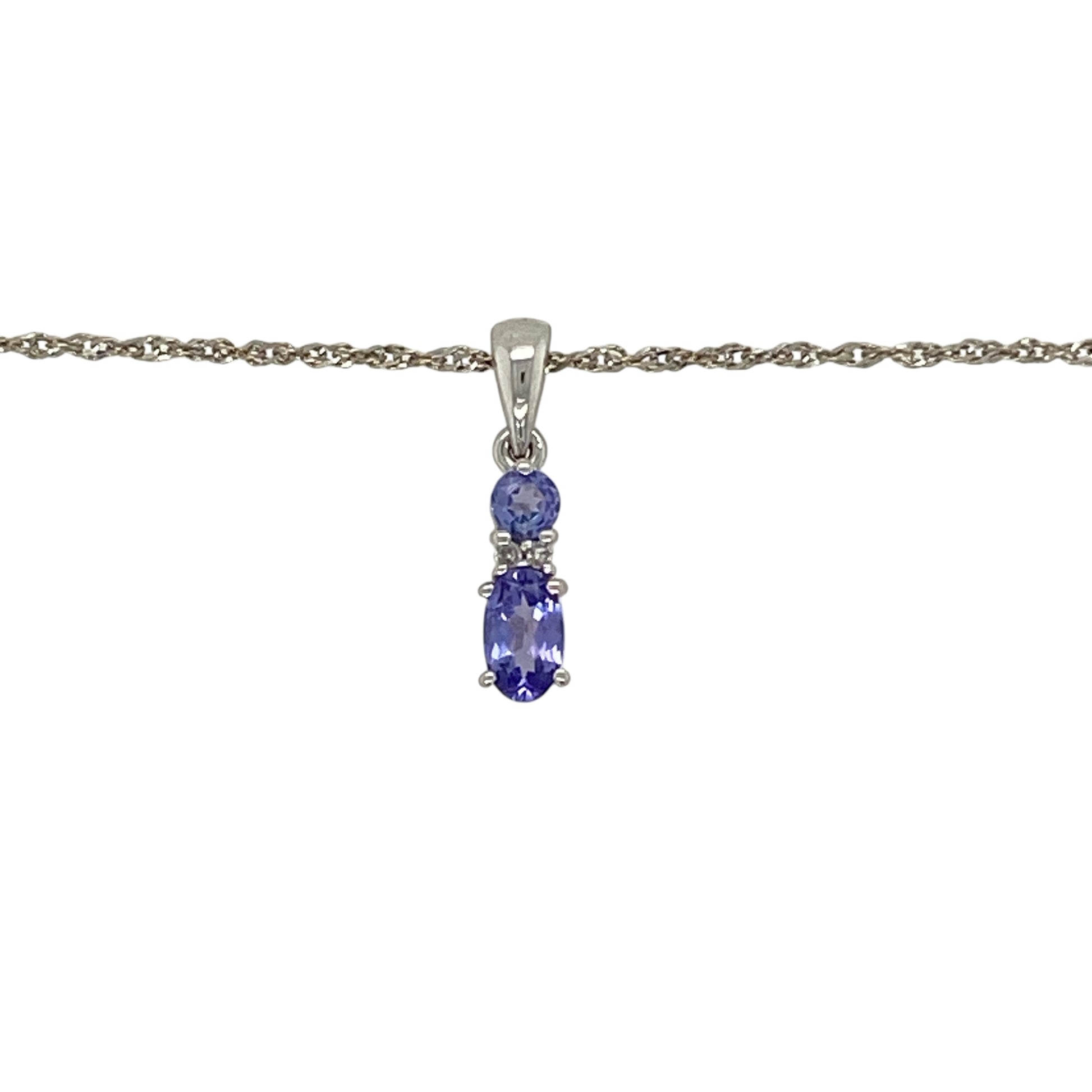 Bring delicate colour and refined sparkle to your jewellery collection with this pre-owned 9ct white gold diamond and tanzanite pendant necklace, a graceful piece with modern elegance.

Design: The pendant features a beautiful tanzanite accented with diamond detailing, creating a refined contrast of soft violet-blue tones and subtle brilliance, suspended from a light-catching sparkle chain.