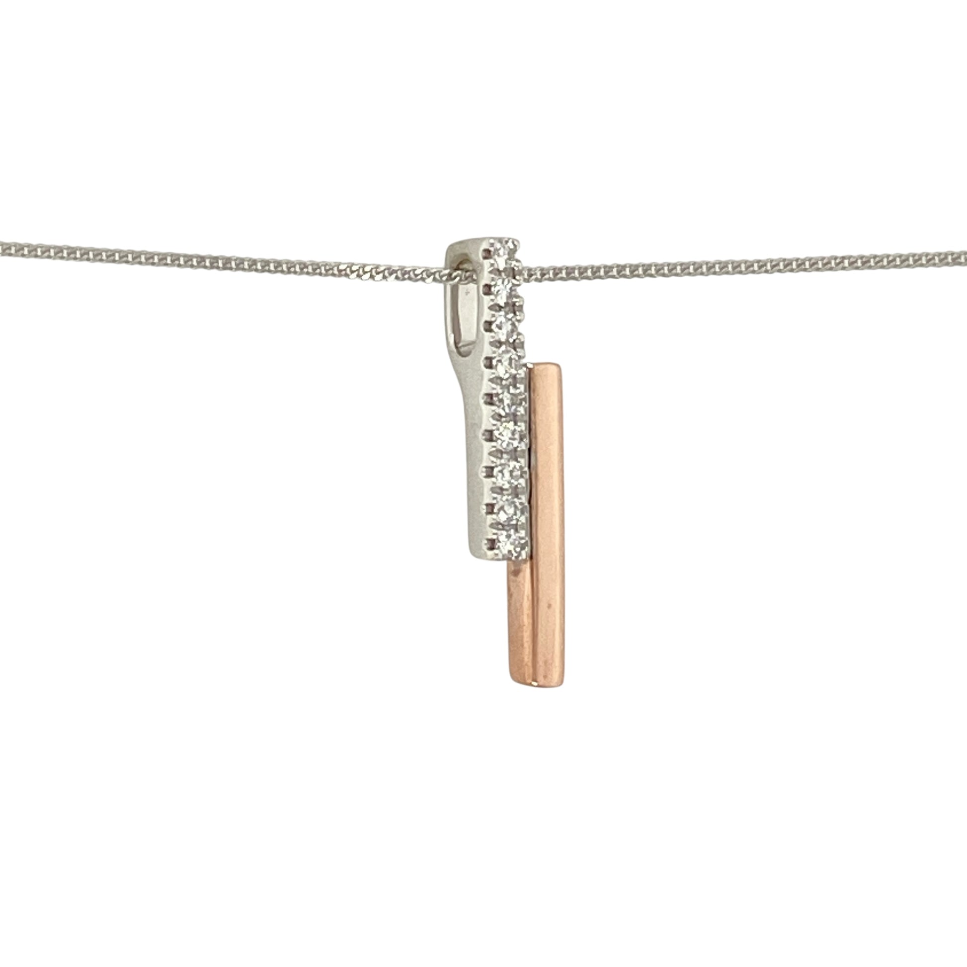 Bring modern elegance and subtle sparkle to your jewellery collection with this pre-owned 9ct white and rose gold diamond set bar pendant necklace, a refined piece with contemporary appeal.

Design: The pendant features a sleek bar design combining white and rose gold tones, accented with diamond detailing for a clean, sophisticated look, suspended from a fine curb chain.