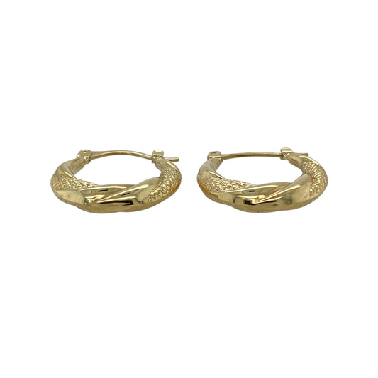 Bring classic style with a decorative twist to your jewellery collection with these pre-owned 9ct yellow gold patterned twisted hoop creole earrings.

Design: The earrings feature a twisted hoop creole shape with subtle patterned detailing, creating added texture and visual interest within a timeless hoop style.
Material: Made from 9-carat yellow gold, the warm polished finish enhances the intricate twist and pattern.