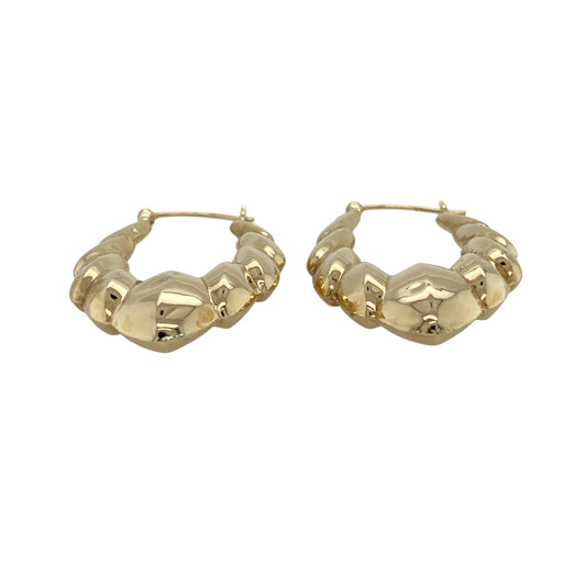 Bring elegant shape and classic style to your jewellery collection with these pre-owned 9ct yellow gold fancy oval shaped creole earrings.

Design: The earrings feature a refined oval creole shape with a slightly decorative profile, offering a graceful alternative to traditional round hoops.
Material: Made from 9-carat yellow gold, the warm polished finish enhances the smooth curves of the oval design.