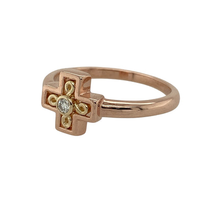 Bring symbolic elegance and Welsh heritage to your jewellery collection with this pre-owned 9ct rose and yellow gold diamond set Clogau Celtic cross ring.

Design: The ring features a Celtic cross motif accented with a subtle diamond, with the front of the ring measuring approximately 9mm in height for a refined yet distinctive presence.
Material: Made from a combination of 9-carat rose and yellow gold, the contrasting tones highlight the traditional design and add warmth and depth.