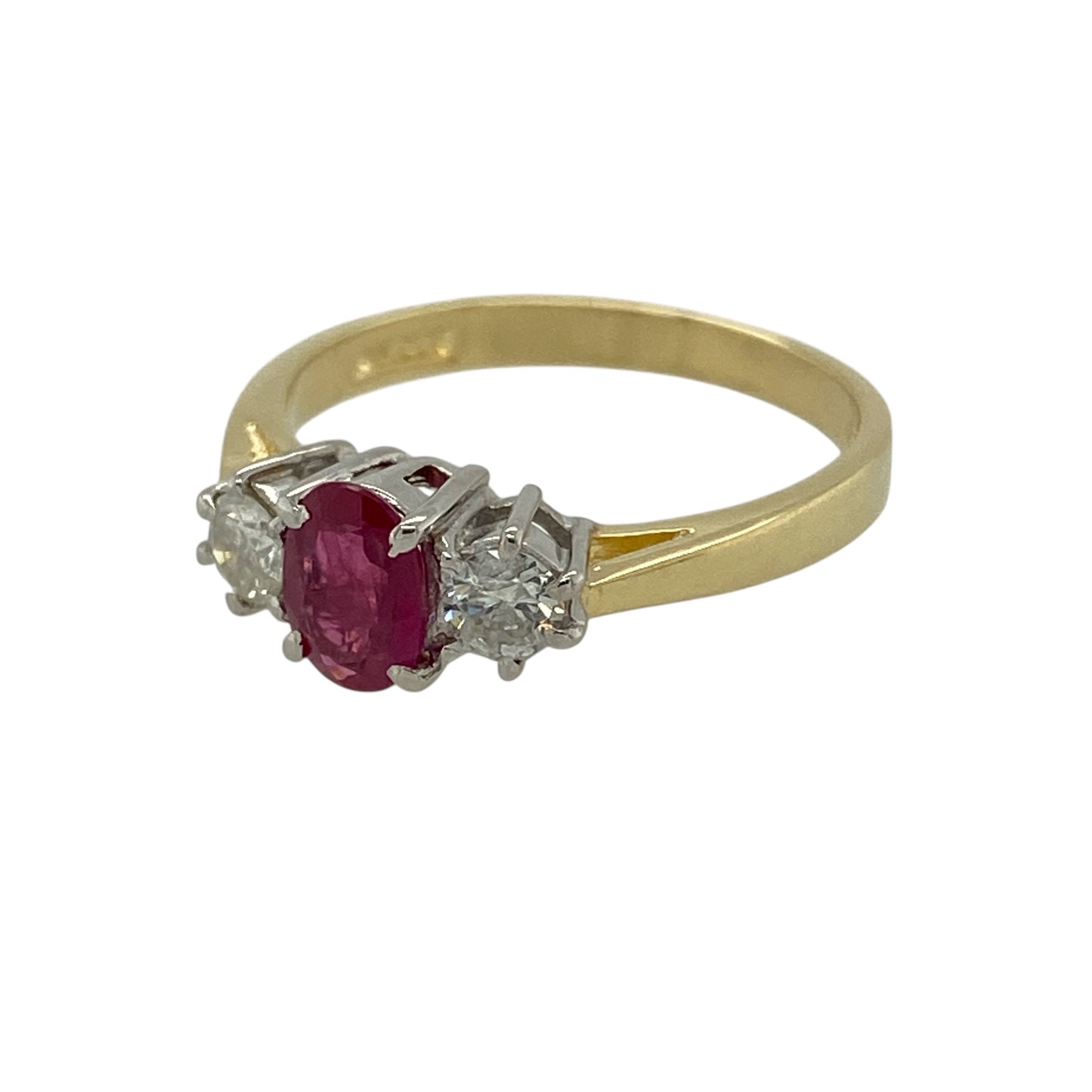 Bring timeless elegance and rich colour to your jewellery collection with this pre-owned 18ct yellow gold diamond and ruby set trilogy ring.

Design: The ring features an oval ruby at the centre, measuring approximately 6mm by 4mm, flanked by a diamond on either side to create a classic and balanced trilogy style.
Material: Made from 18-carat yellow gold, the warm polished finish beautifully enhances the deep red of the ruby and the brilliance of the diamonds.
