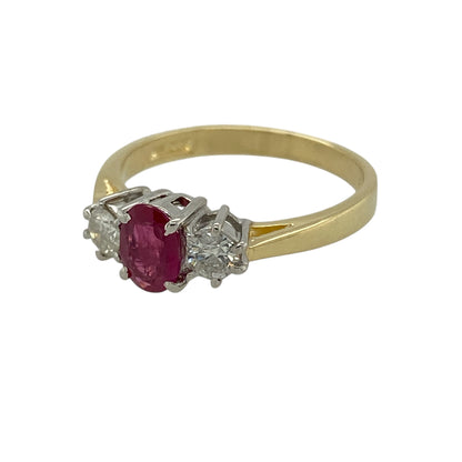 Bring timeless elegance and rich colour to your jewellery collection with this pre-owned 18ct yellow gold diamond and ruby set trilogy ring.

Design: The ring features an oval ruby at the centre, measuring approximately 6mm by 4mm, flanked by a diamond on either side to create a classic and balanced trilogy style.
Material: Made from 18-carat yellow gold, the warm polished finish beautifully enhances the deep red of the ruby and the brilliance of the diamonds.