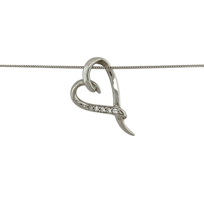 Bring delicate sparkle and romantic elegance to your jewellery collection with this pre-owned 9ct white gold diamond set open heart pendant necklace.

Design: The pendant features an open heart outline accented with shimmering diamonds, measuring approximately 2cm in length to create a graceful and eye-catching silhouette.
Material: Made from 9-carat white gold, the bright polished finish enhances the brilliance of the diamonds and gives the piece a clean, contemporary look.
