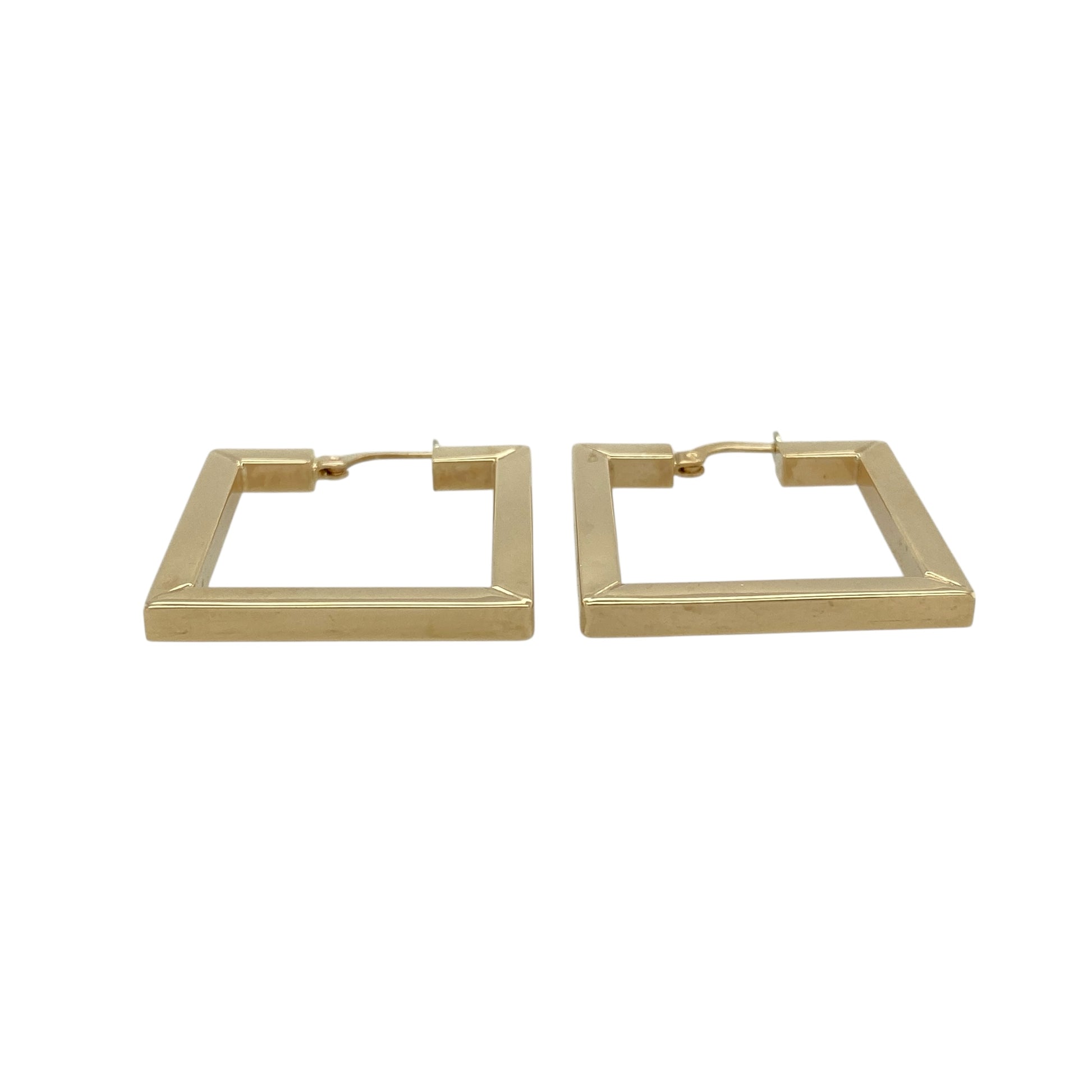 Bring bold shape and classic gold elegance to your jewellery collection with these pre-owned 9ct yellow gold square creole earrings.

Design: The earrings feature a distinctive square creole shape, offering a modern twist on the traditional hoop style with clean lines and a confident look.
Material: Made from 9-carat yellow gold, the warm polished finish enhances the structured shape and timeless appeal.