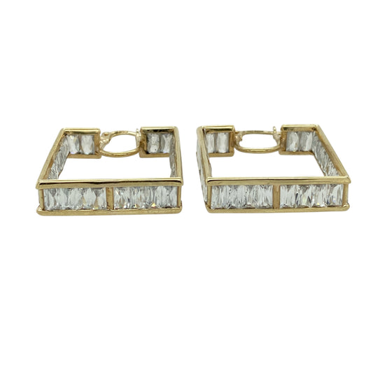 Bring bold sparkle and contemporary style to your jewellery collection with these pre-owned 9ct yellow gold and cubic zirconia set square creole earrings.

Design: The earrings feature a modern square creole shape, set with shimmering cubic zirconia that adds eye-catching brilliance to the structured silhouette.
Material: Made from 9-carat yellow gold, the warm polished finish beautifully complements the bright sparkle of the cubic zirconia stones.