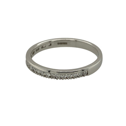 Bring understated sparkle and timeless elegance to your jewellery collection with this pre-owned 18ct white gold diamond set band ring.

Design: The ring features a slim band-style front measuring approximately 2mm in width, accented with sparkling diamonds for a refined and delicate look.
Material: Made from 18-carat white gold, the bright polished finish enhances the brilliance of the diamonds and offers a clean, sophisticated appearance.
