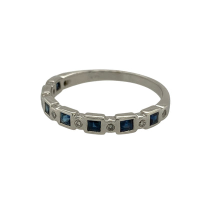 Bring classic colour and refined sparkle to your jewellery collection with this pre-owned 14ct white gold diamond and sapphire set band ring.

Design: The ring features a slim band-style front measuring approximately 3mm in width, set with rich blue sapphires and sparkling diamond accents for a timeless and elegant look.
Material: Made from 14-carat white gold, the bright polished finish beautifully enhances the deep blue tones of the sapphires and the brilliance of the diamonds.