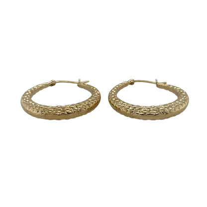 Bring subtle detail and timeless style to your jewellery collection with these pre-owned 9ct yellow gold textured hoop creole earrings.

Design: The earrings feature a classic hoop creole shape with a textured finish, adding depth and visual interest to a clean and elegant silhouette.
Material: Made from 9-carat yellow gold, the warm polished finish beautifully highlights the textured detailing.