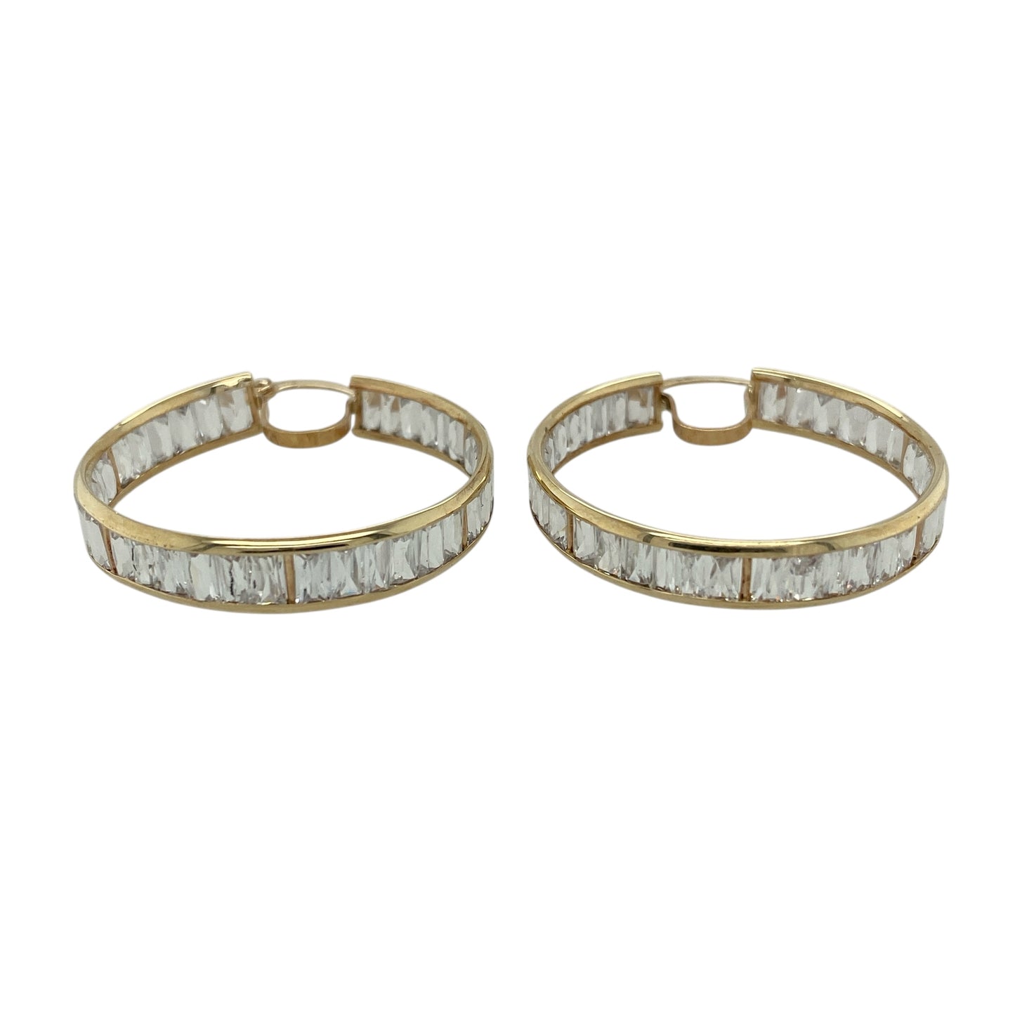 Bring bold sparkle and classic elegance to your jewellery collection with these pre-owned 9ct yellow gold and cubic zirconia set hoop creole earrings.

Design: The earrings feature a timeless hoop creole shape, set with shimmering cubic zirconia stones that add eye-catching brilliance throughout the design.
Material: Made from 9-carat yellow gold, the warm polished finish beautifully complements the bright sparkle of the cubic zirconia. 