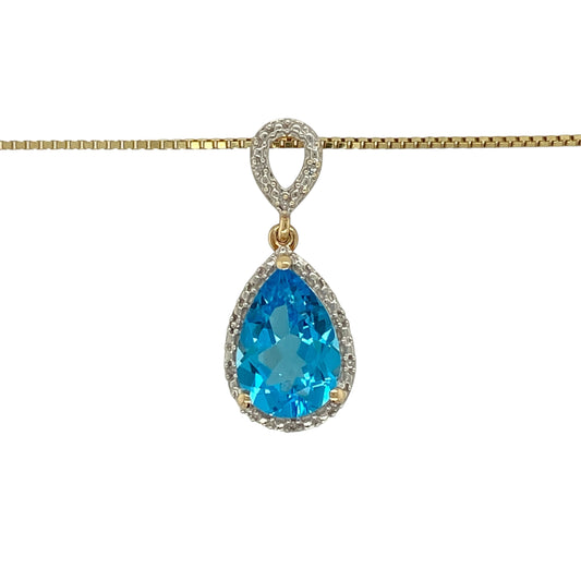 Bring elegant colour and refined sparkle to your jewellery collection with this pre-owned 9ct yellow gold diamond and blue topaz set teardrop pendant necklace.

Design: The pendant features a striking teardrop-shaped blue topaz measuring approximately 13mm by 9mm, creating a vibrant and eye-catching focal point. The pendant measures approximately 2.8cm in length including the bail, giving it a graceful and elegant presence.
Material: Made from 9-carat yellow gold