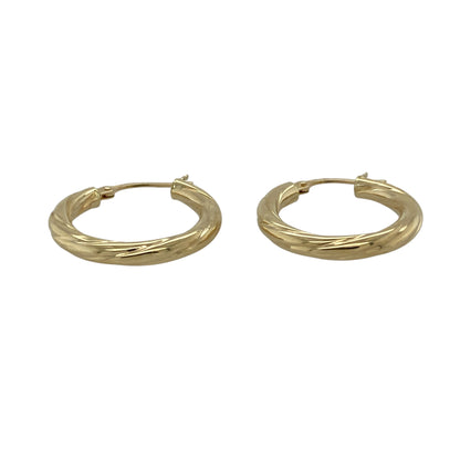 Bring classic elegance with a subtle twist to your jewellery collection with these pre-owned 9ct yellow gold twisted hoop creole earrings.

Design: The earrings feature a timeless hoop creole shape with a twisted finish, adding gentle texture and visual interest to a classic silhouette.
Material: Made from 9-carat yellow gold, the warm polished finish beautifully enhances the flowing twist detail.