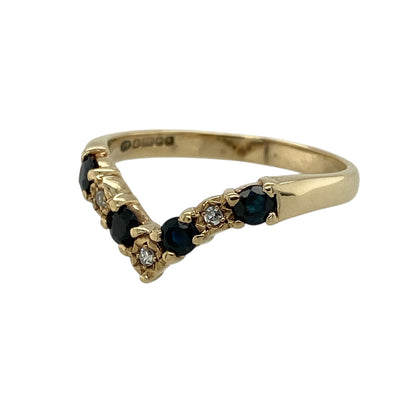 Bring elegant colour and graceful sparkle to your jewellery collection with this pre-owned 9ct yellow gold diamond and sapphire set wishbone ring.

Design: The ring features a classic wishbone silhouette, set with rich blue sapphires, each measuring approximately 3mm in diameter, creating a refined and eye-catching look.
Material: Made from 9-carat yellow gold, the warm polished finish beautifully complements the deep blue tones of the sapphires and the brilliance of the diamonds.
