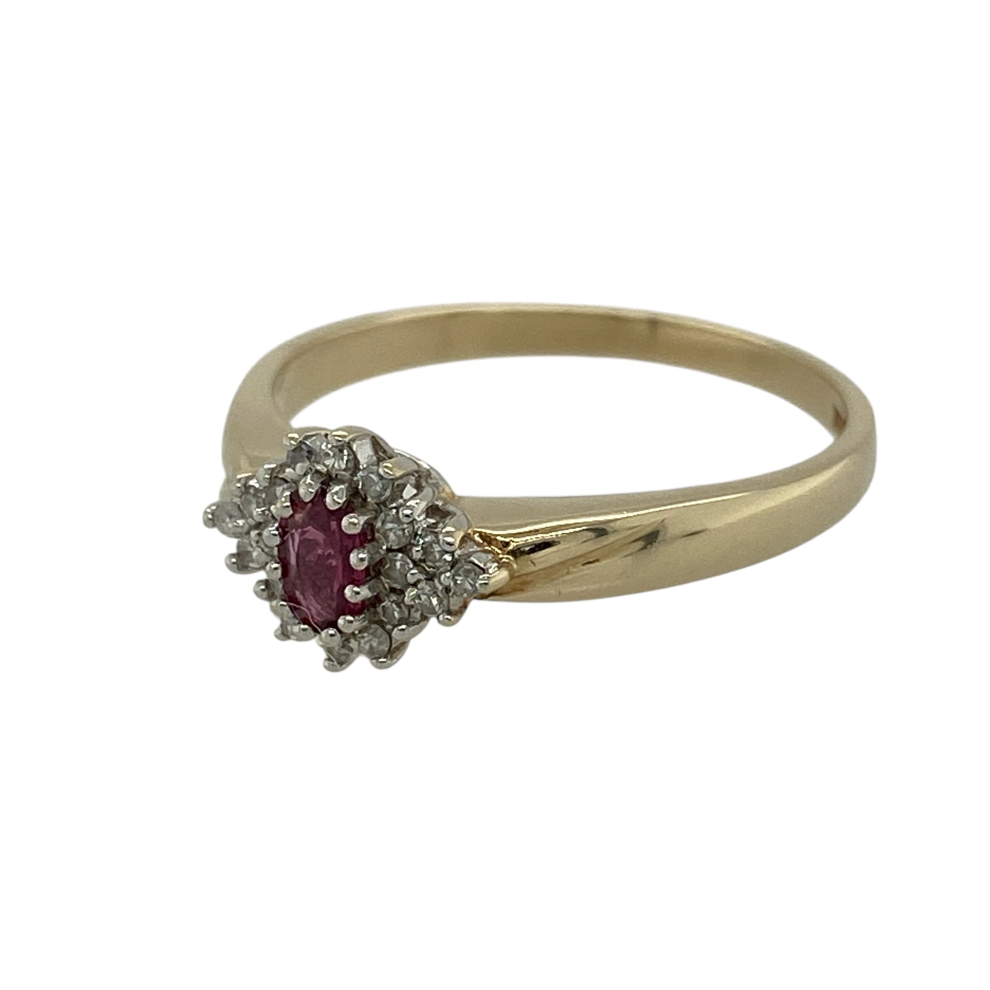 Bring rich colour and classic sparkle to your jewellery collection with this pre-owned 9ct yellow gold diamond and ruby set cluster ring.

Design: The ring features a delicate oval ruby at the centre, measuring approximately 4mm by 2mm, surrounded by a halo of sparkling diamonds to create a timeless cluster design.
Material: Made from 9-carat yellow gold, the warm polished finish beautifully enhances the vivid red of the ruby and the brilliance of the diamonds.