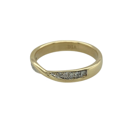 Bring elegant sparkle and timeless style to your jewellery collection with this pre-owned 9ct yellow gold diamond set crossover band ring.

Design: The ring features a refined crossover band design, creating a flowing and elegant look with subtle diamond accents for added brilliance.
Material: Made from 9-carat yellow gold, the warm polished finish beautifully complements the sparkle of the diamonds.