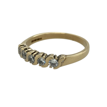 Bring subtle sparkle and classic style to your jewellery collection with this pre-owned 9ct yellow gold cubic zirconia set band ring, offering a refined and versatile look—perfect for everyday wear or special occasions.

Design: The ring features a row of round cubic zirconia stones, each measuring approximately 3mm in diameter, creating a clean and balanced band style with eye-catching brilliance.