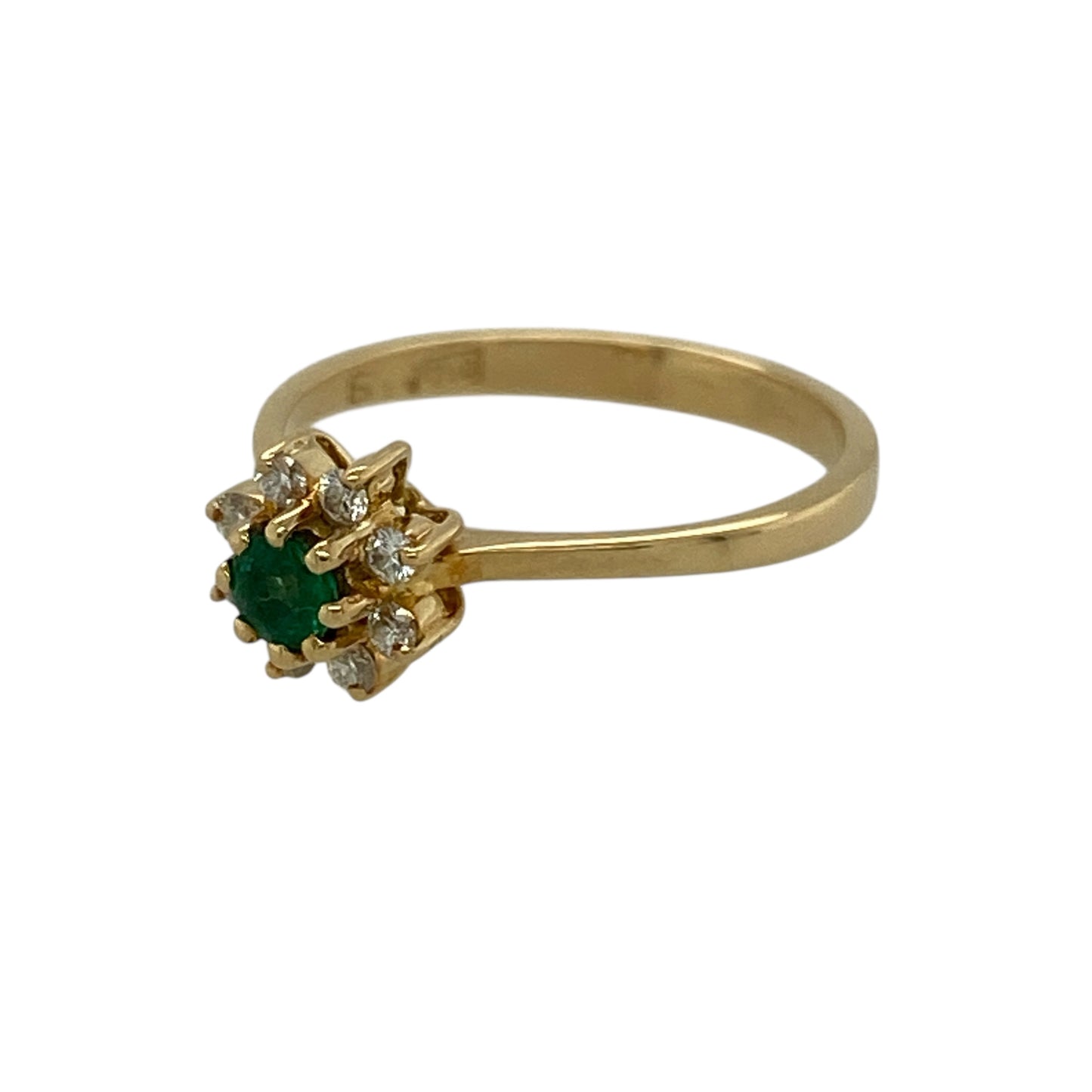 Bring fresh colour and classic elegance to your jewellery collection with this pre-owned 18ct yellow gold diamond and emerald flower cluster ring, featuring a timeless floral design with vibrant detail—perfect for everyday wear or special occasions.

Design: The ring showcases a flower cluster design with a vivid emerald at the centre measuring approximately 3mm in diameter, surrounded by sparkling diamonds that form a delicate floral arrangement.