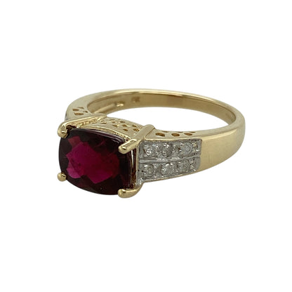 Bring rich colour and elegant contrast to your jewellery collection with this pre-owned 9ct yellow and white gold diamond and red stone set ring, featuring a striking centre stone with refined diamond accents—perfect for special occasions or standout everyday wear.

Design: The ring highlights an elongated cushion-cut red garnet–coloured stone with a length of approximately 9mm, creating a bold and eye-catching focal point. Diamond accents adorn the shoulders, adding sparkle and balance to the design.