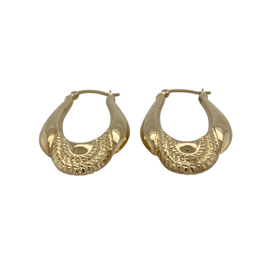 Bring classic style and refined detail to your jewellery collection with these pre-owned 9ct yellow gold patterned oval creole earrings, offering a timeless design with a more substantial feel—perfect for everyday wear or special occasions.

Design: The earrings feature an oval creole shape with a patterned finish, adding texture and visual interest while maintaining a clean and elegant look.
Material: Made from 9-carat yellow gold, the polished patterned surface enhances the warm golden tone beautifully.