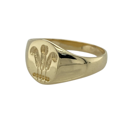 Bring heritage-inspired style and timeless character to your jewellery collection with this pre-owned 9ct yellow gold three feathers oval signet ring, featuring a classic symbol with refined proportions—perfect for everyday wear or statement styling.

Design: The ring showcases an oval signet face displaying the traditional three feathers motif, with the front of the ring measuring approximately 11mm in height for a bold yet balanced presence.