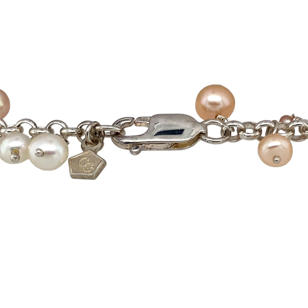 Preowned 925 Silver with 9ct Rose Gold & Pearl Shell Clogau Beachcomber 7.5" Bracelet with the weight 17.10 grams. The bracelet contains white and peach coloured pearls with shell, circle and heart charms