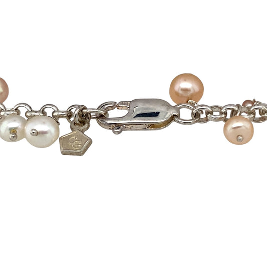 Preowned 925 Silver with 9ct Rose Gold & Pearl Shell Clogau Beachcomber 7.5" Bracelet with the weight 17.10 grams. The bracelet contains white and peach coloured pearls with shell, circle and heart charms