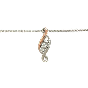 Celebrate life’s journey with this pre-owned 925 silver and 9ct rose gold Clogau Past, Present and Future pendant—a symbolic design enhanced with white topaz sparkle and timeless elegance.

Design: The pendant measures 1.8cm long and features three white topaz stones in a vertical arrangement, representing the past, present, and future. Delicate 9ct rose gold detailing adds warmth and meaning to the design.
