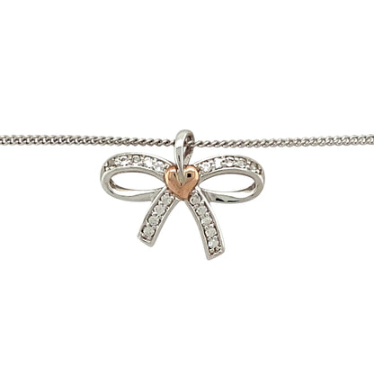 Preowned 925 Silver and 9ct Rose Gold Clogau & White Topaz Set Clogau Bow Pendant on an 18”, 20" to 22" Clogau curb chain with the weight 4.20 grams. The pendant is 1.6cm long including the bail