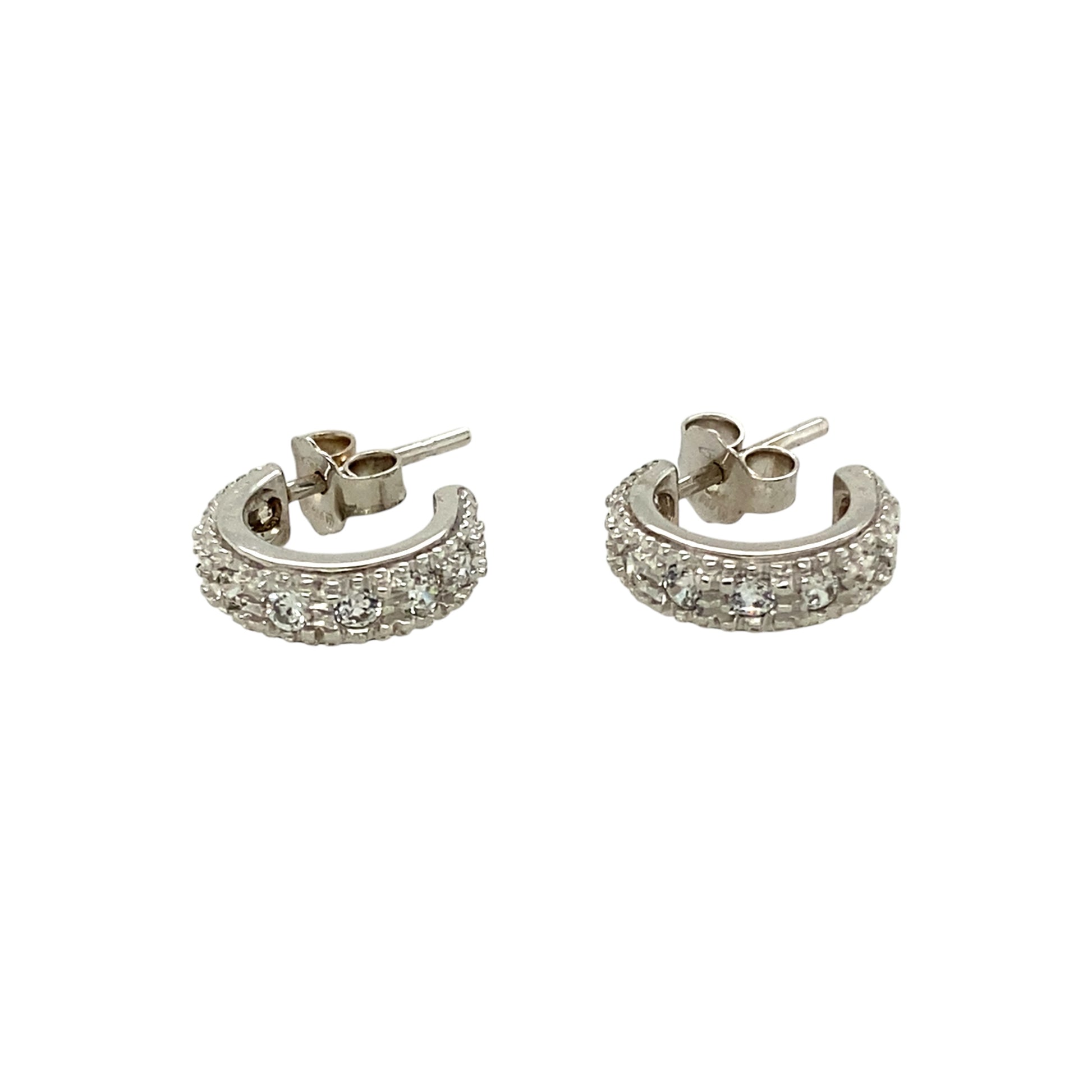 Add a touch of elegance to your jewellery collection with these pre-owned 18ct white gold and cubic zirconia set half hoop stud earrings, featuring:

Design: Classic half hoop stud earrings, set with sparkling cubic zirconia for a timeless and sophisticated look.
Material: Crafted from 18-carat white gold, offering a sleek and luxurious finish.
Weight: A well-balanced 3.40 grams, ensuring durability while remaining comfortable to wear.
A versatile and stylish accessory, perfect for adding subtle sparkle to 