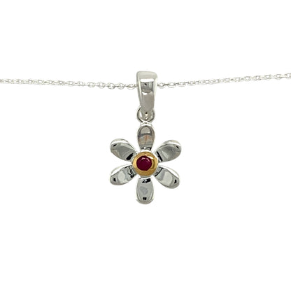 Add a touch of elegance and personal meaning to your jewellery collection with this new 925 silver & ruby set flower July birthstone pendant necklace, featuring:

Design: A delicate flower-shaped pendant, set with a vibrant ruby birthstone at its centre for a timeless and meaningful touch.
Material: 925 sterling silver, with a gold-plated setting around the ruby for added warmth and contrast.
Gemstone: Features a 2mm diameter ruby, known as the birthstone for July, symbolising passion and prosperity.
